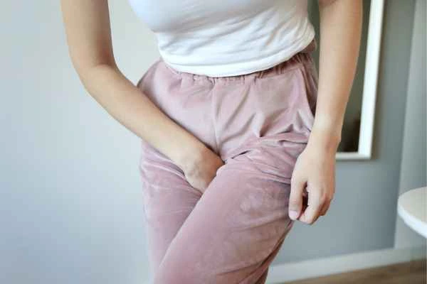 woman running for the toilet because of urinary incontinence Merton